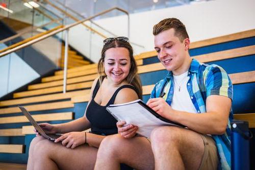 Two students reviewing notes